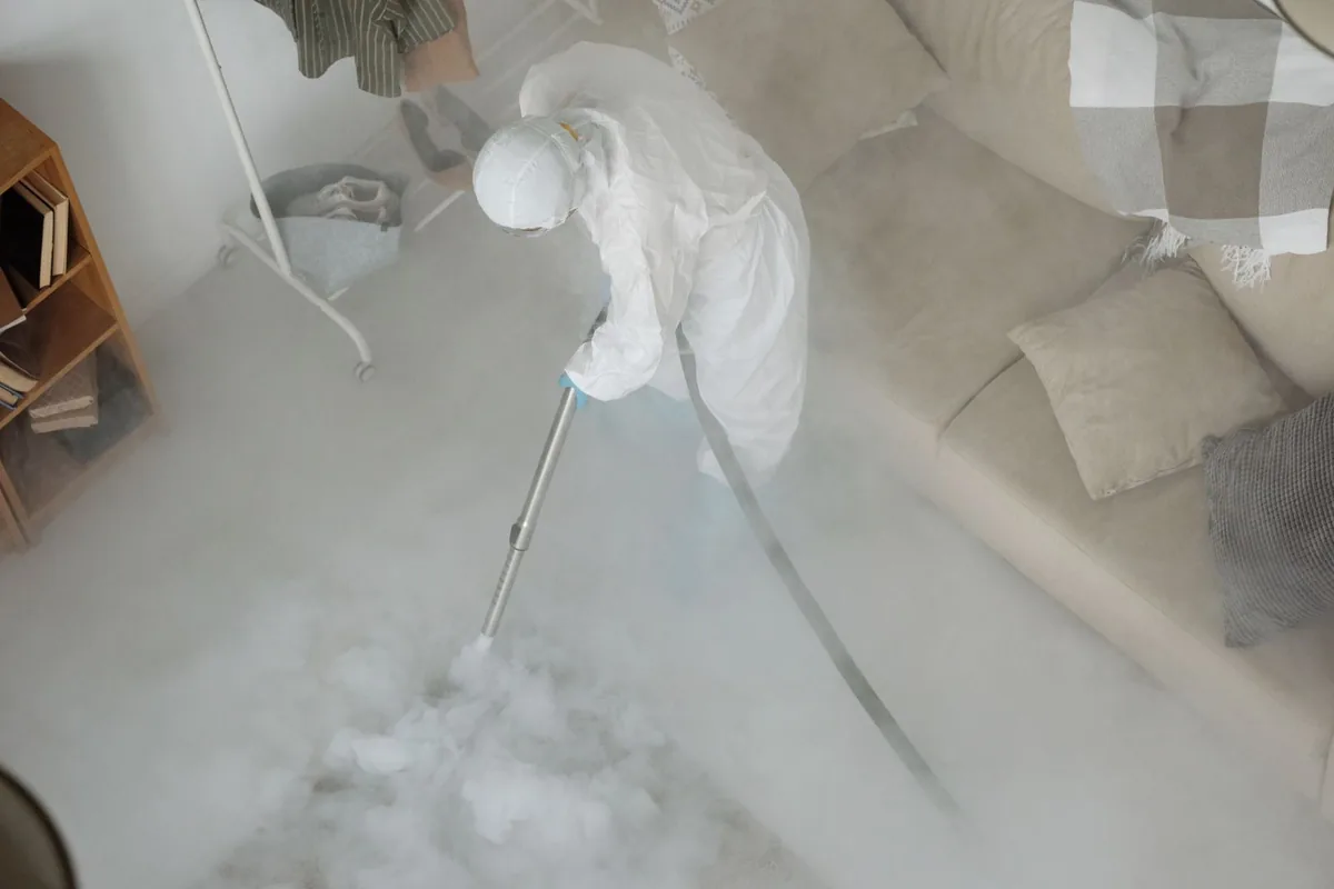 Biohazard cleanup technician in protective equipment, South Apopka, FL